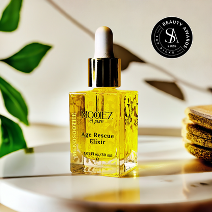 Yellow bottle of MOOEZ Age Rescue Elixir on a white surface with a plant in the background and a beauty award winner seal.